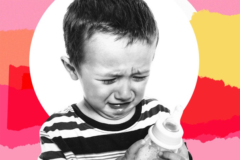 A crying preschooler holding an empty milk bottle.